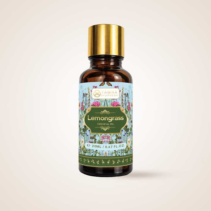 Tamra Ayurveda Lemongrass essential oil bottle with decorative label on a light beige background