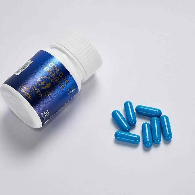 Blue capsules and a bottle of 'Tamra Gold Dragon' on a white background