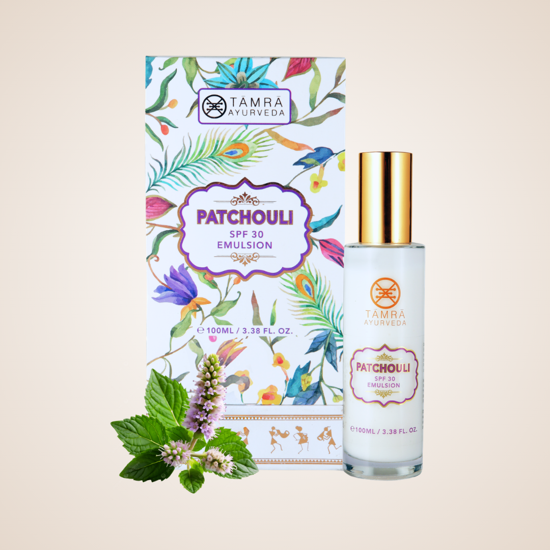 Tamra Ayurveda Patchouli SPF 30 Emulsion bottle and packaging on a beige background