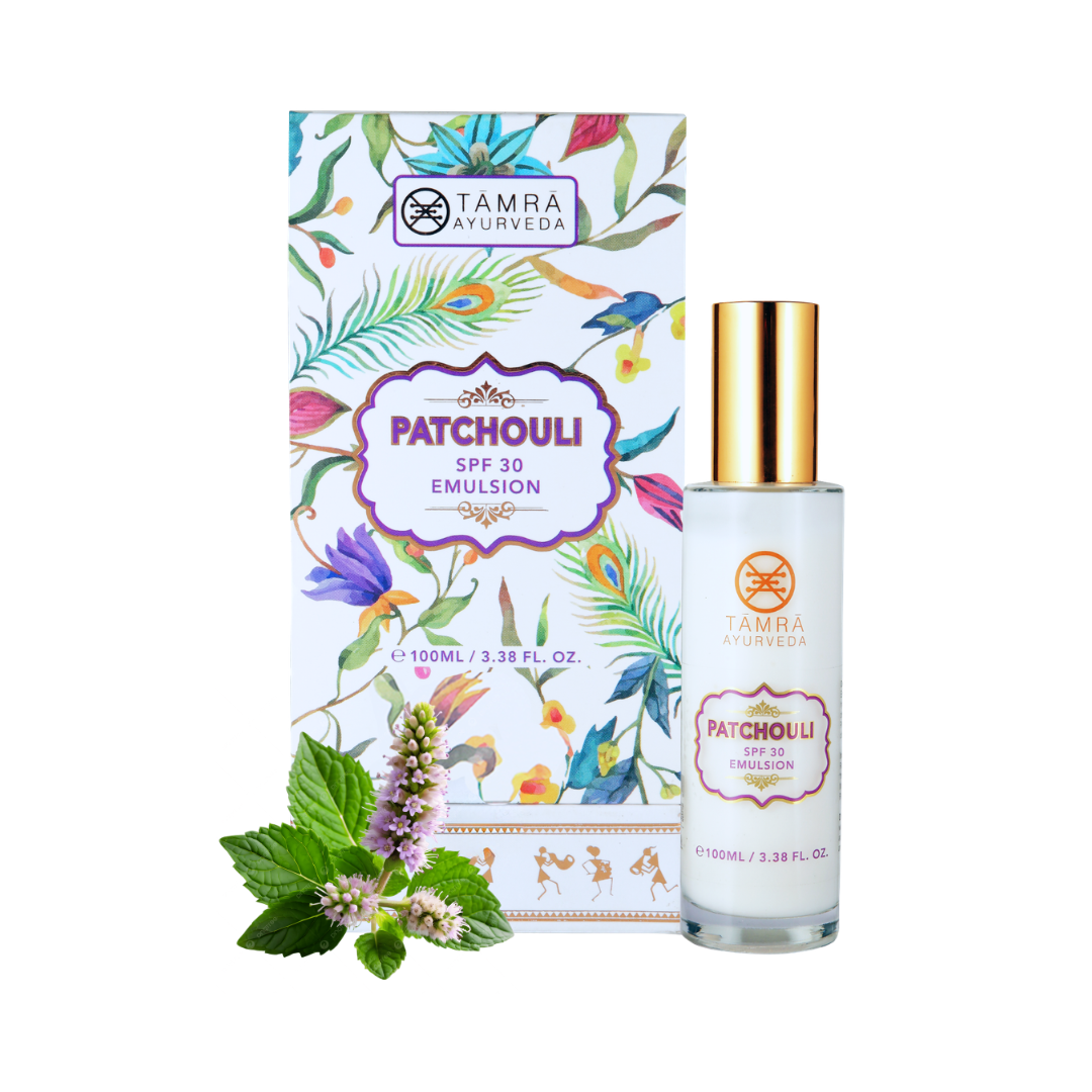 Patchouli SPF 30 emulsion with packaging and mint leaves on a white background