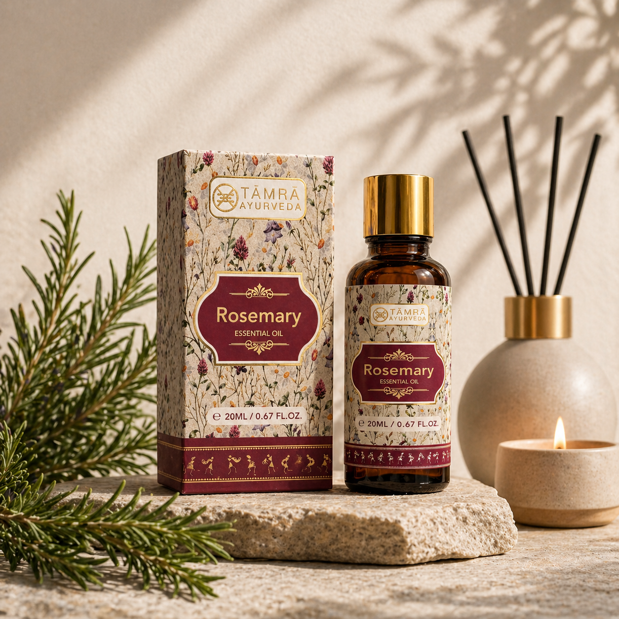 Tamra Ayurveda Rosemary essential oil bottle and packaging on a wooden surface with decorative elements.