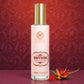 Tamra Ayurveda Saffron Repair Emulsion bottle with a red floral element on a red patterned background