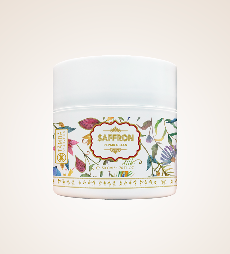 Jar of Tamra Ayurveda saffron repair uttan with floral design on a light background