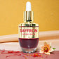Tamra Saffron repair serum bottle with a yellow background