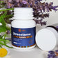 Stresstame tablets bottle with lavender and flowers on a light background