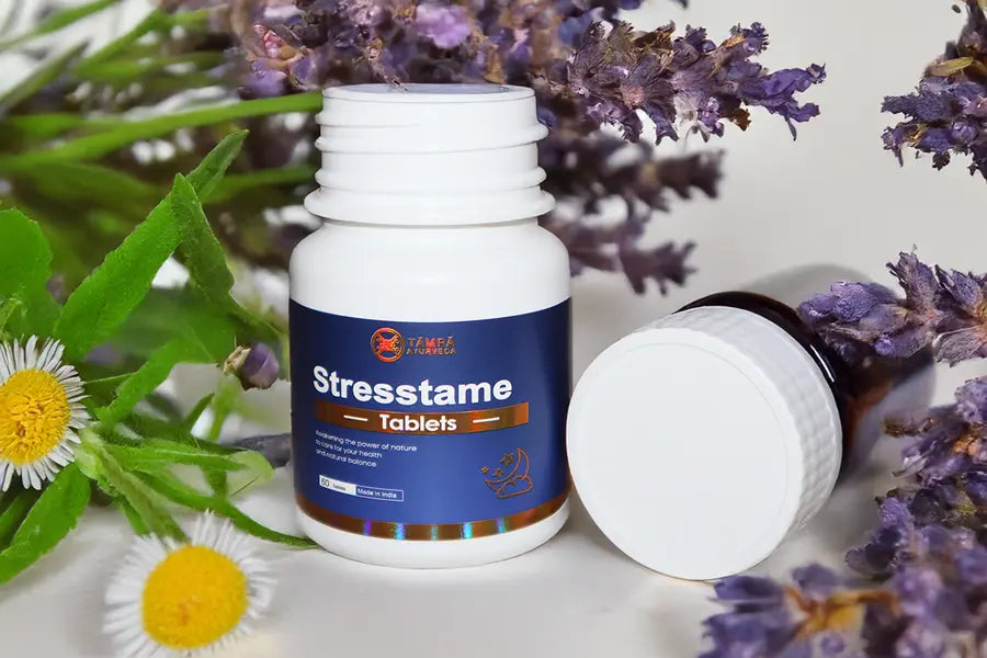 Stresstame tablets bottle with lavender and flowers on a light background