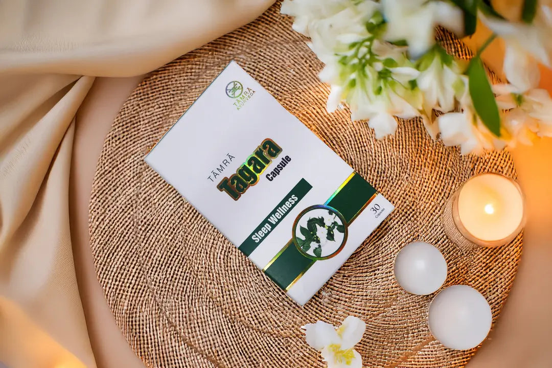 Tamra Tagara 30 Capsules packaging on a textured surface with flowers and candles