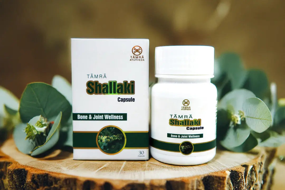 Tamra Shailaki capsules and box on a wooden surface with green leaves in the background
