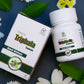 TAMRA Triphala Capsule packaging and bottle on a dark background with flowers