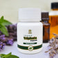Tamra Ayurveda Triphala Capsule bottle with herbs and flowers on a light background