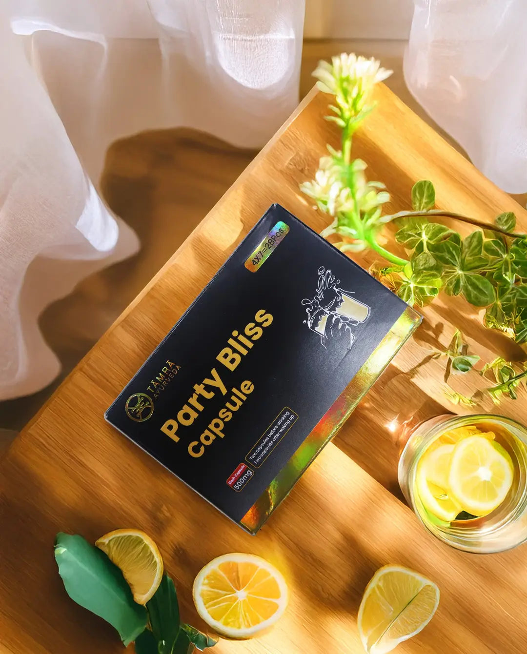 Box of 'Tamra Party Bliss' capsules on a wooden surface.