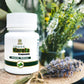 Tamra Ayurveda Karela Capsule bottle with flowers and lavender.