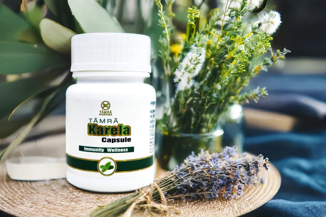 Tamra Ayurveda Karela Capsule bottle with flowers and lavender.