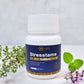 Bottle of Stresstame tablets with a white background and greenery