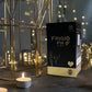Tamra Ayurveda Frigid Fix product packaging with candles and decorative lanterns on a dark surface.
