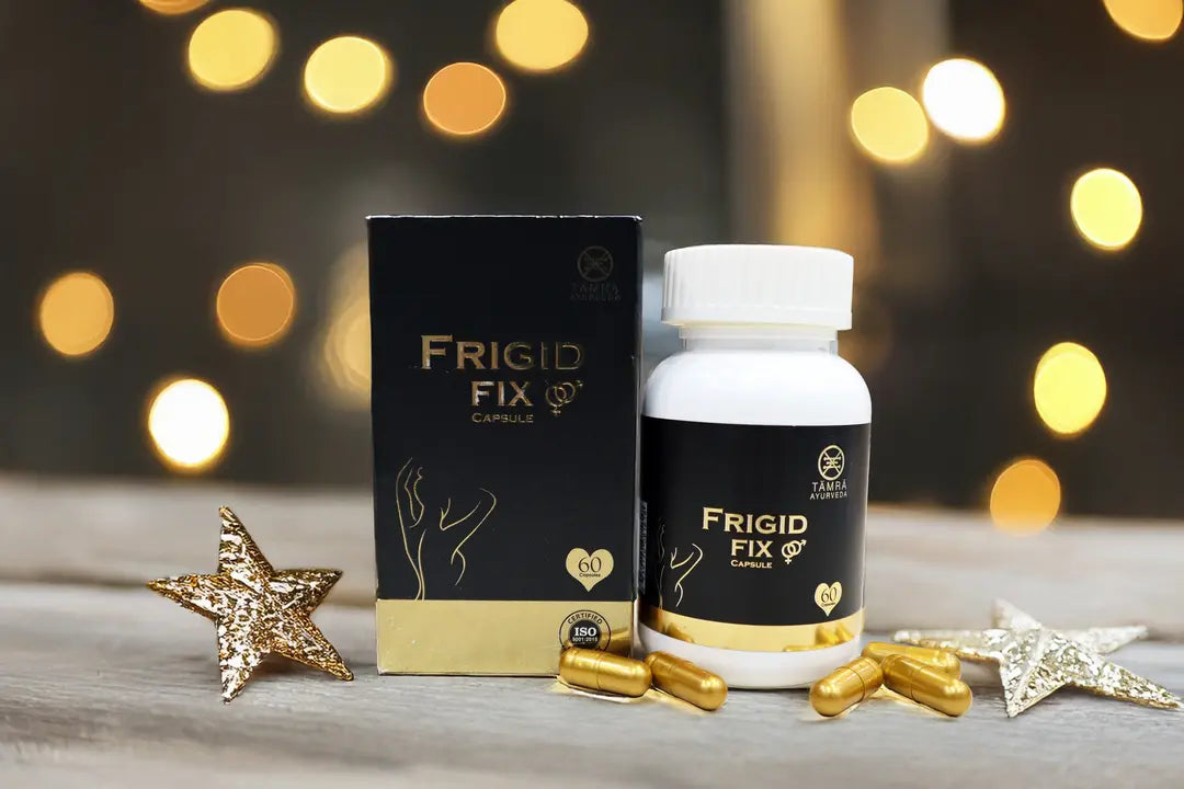 Frigid Fix capsules and packaging on a wooden surface with decorative lights in the background
