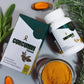 Curcumin capsules with packaging, turmeric roots, and powder on a gray background