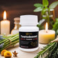 Tamra Testoboost supplement bottle with candles and plants on a wooden surface.