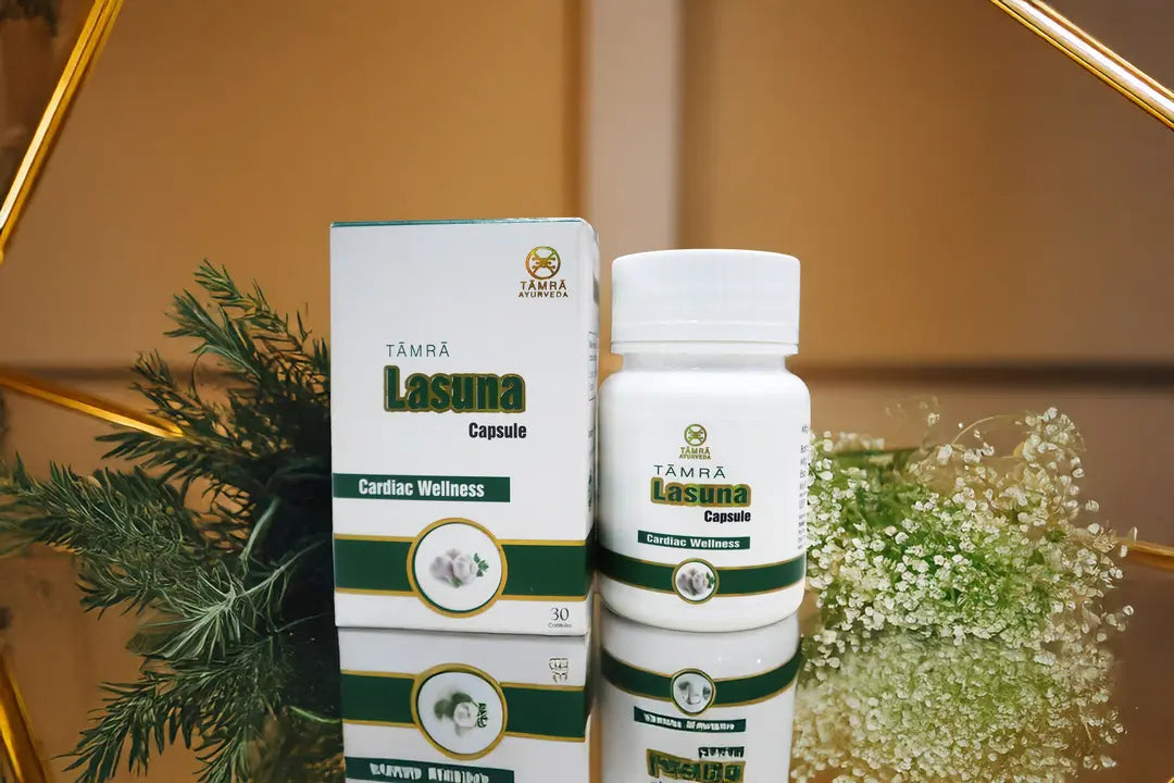 Tamra Lasuna Capsule packaging on a reflective surface with decorative elements.