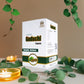 Box of Tamra Guduchi Capsules with green leaves and a candle in the background