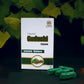 Tamra Guduchi capsule packaging with capsules on a dark background with candles and leaves.