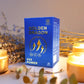 Tamra Ayurveda 'Golden Dragon Capsules' with lit candles and decorative plants on a neutral background.
