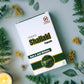 Tamra Ayurveda Shallaki capsule box surrounded by green leaves and candles.